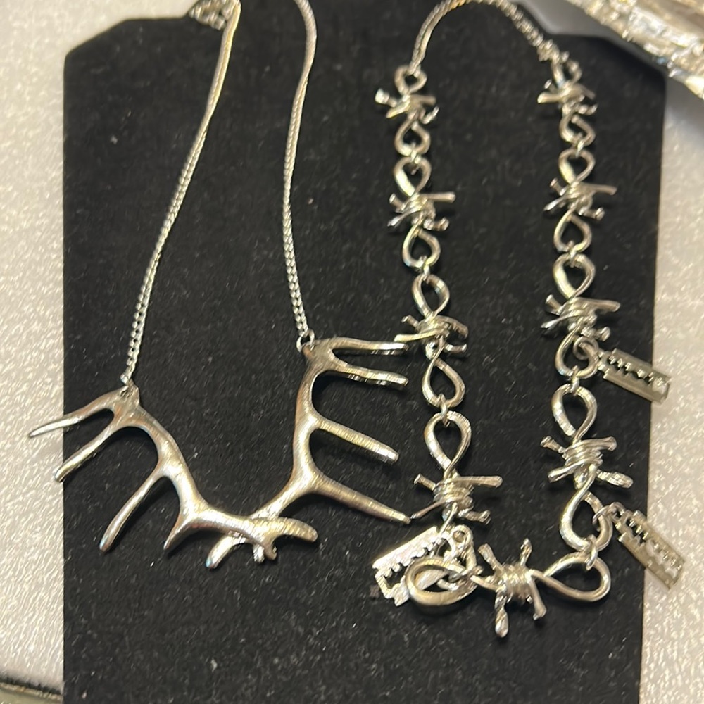 Two  punk silver tone necklaces deer antlers and barbed wire and razors